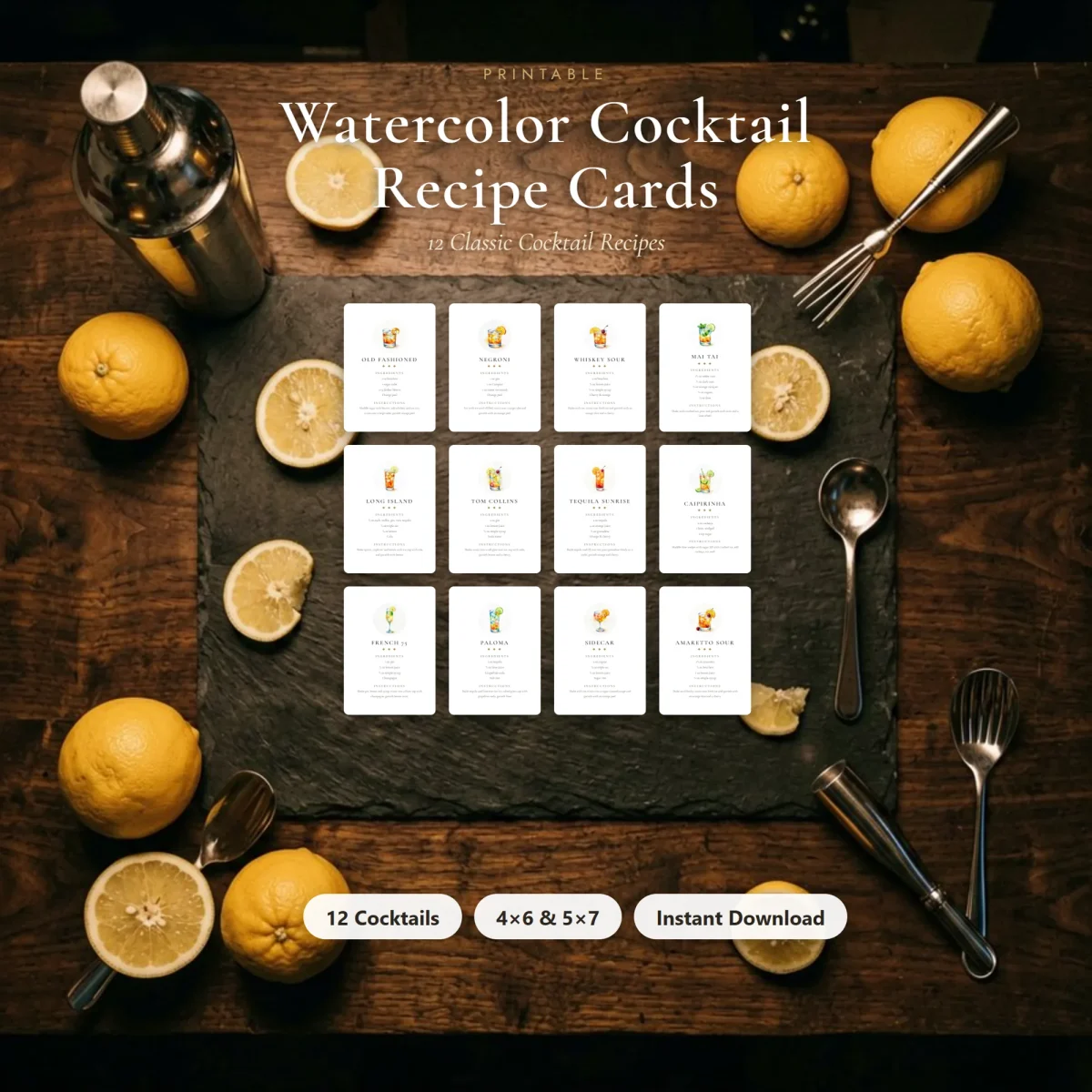 Twelve cocktail recipe cards on a slate board surrounded by lemons, a shaker and bar spoons, under the title Watercolor Cocktail Recipe Cards