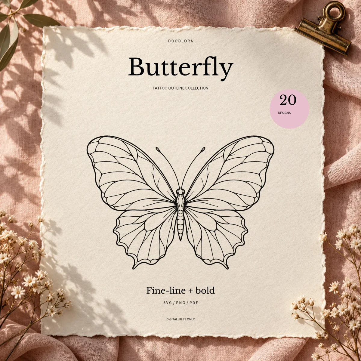 The fine-line spread butterfly outline printed on a deckled cream card on pink linen, titled Butterfly tattoo outline collection, 20 designs