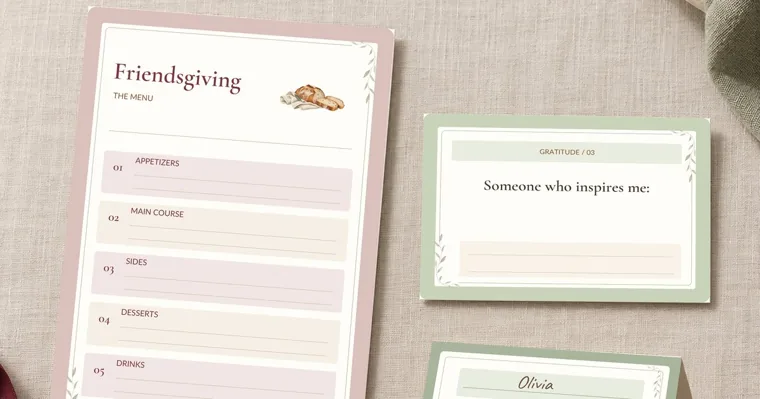A blush Friendsgiving menu with spaces for appetizers, main course, sides, desserts and drinks, beside a sage gratitude card and a place card for Olivia